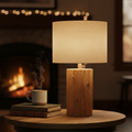 Rustic wooden table lamp with warm amber glow on a side table